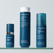 The blue Leave-In Conditioning Spray stands upright against a light blue background, highlighting lasting detangling and weightless conditioning as your wash day essential.