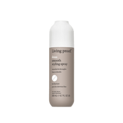 A 200 ml (6.7 fl oz) bottle of No Frizz Smooth Styling Spray, designed for fine hair with a white cap and taupe label, featuring text about its smoothing and detangling benefits.
