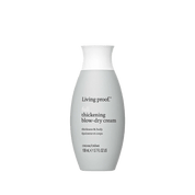 A grey bottle of Full Thickening Blow-Dry Cream (109 ml/3.7 fl oz) with a white cap and black text delivers thicker-looking hair, adds body, and provides heat protection while styling.