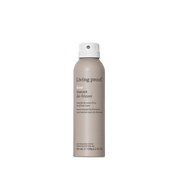 A beige aerosol can of No Frizz Instant De-Frizzer dry conditioning spray with a white cap and black text, shown against a plain white background. Helps fight frizz and restore softness to hair.