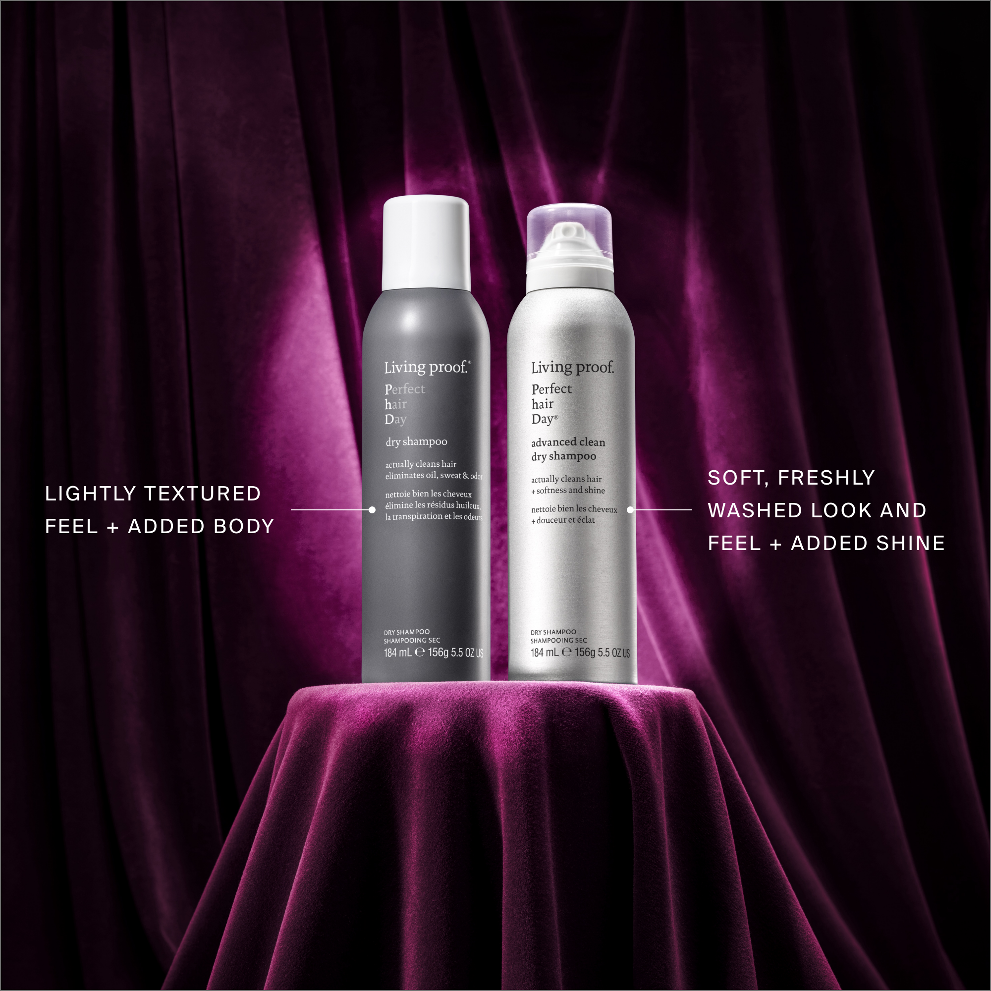Two bottles of Living Proof Perfect Hair Day dry shampoo on a purple surface with text describing product features.