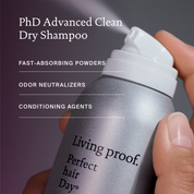 Living Proof PhD Advanced Clean Dry Shampoo being held with a dark background