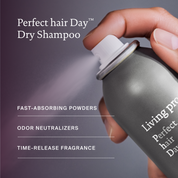Living Proof Perfect hair Day dry shampoo being held with a dark background