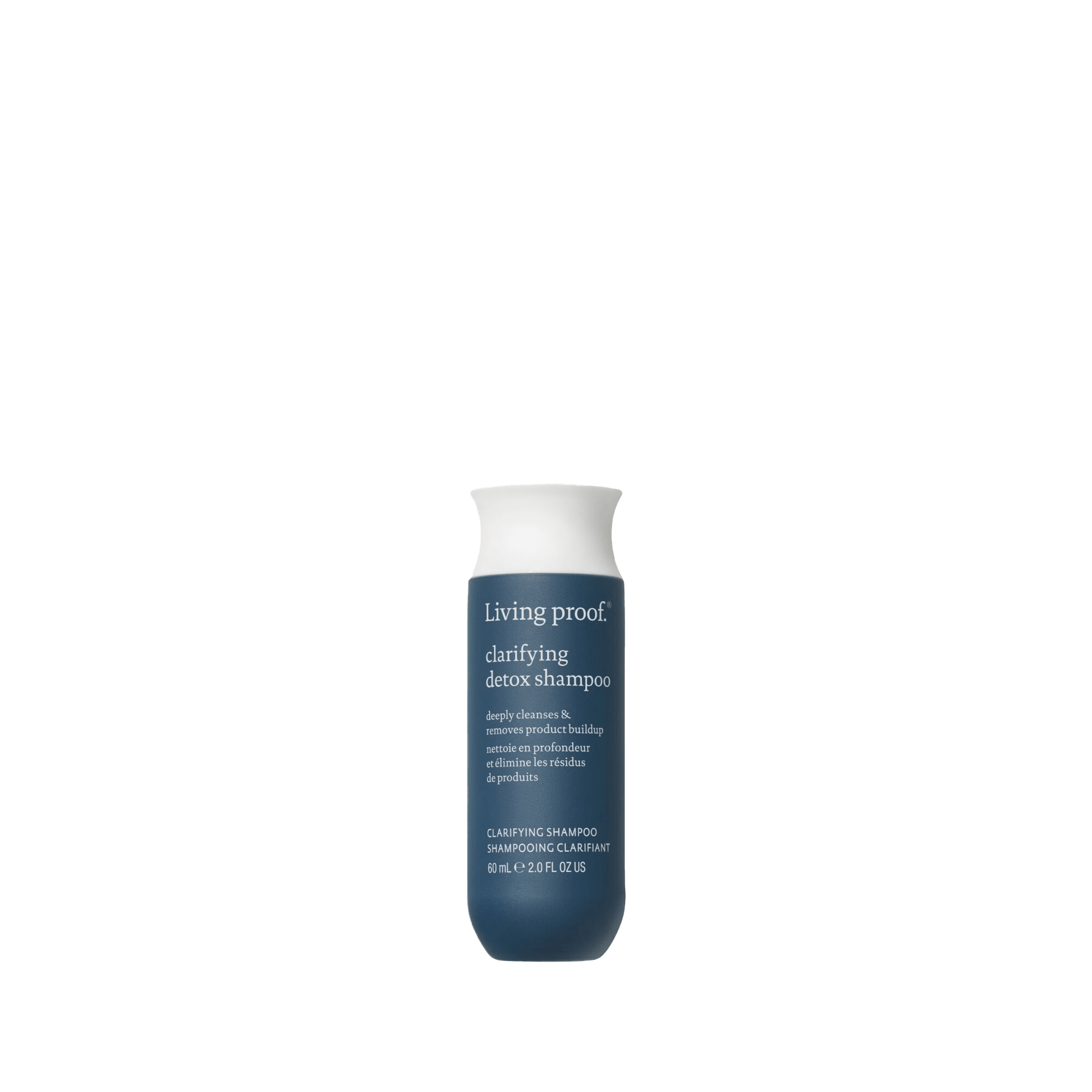 A bottle of Clarifying Detox Shampoo with a dark blue body, white cap, and white front text stands upright against a plain background. This shampoo removes buildup from hard water.