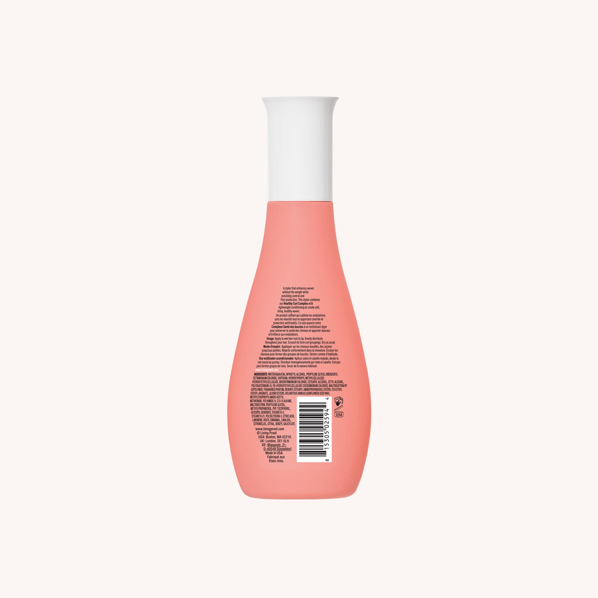 A pink Curl Enhancer bottle with a white cap, shown from the back with small text and a barcode on the label, ideal for frizz protection as a conditioning styler, set against a plain light background.