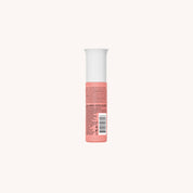 The Curl Moisturizing Shine Oil is a pink cylindrical bottle with a white cap, shown from the back with fine printed text and a barcode. It contains biomimetic oil to help restore hairs natural lipids, set against an off-white background.