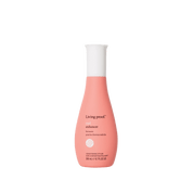 A pink Curl Enhancer bottle with a white cap, designed for waves, protects against frizz and boosts natural texture; features black product details on the front.
