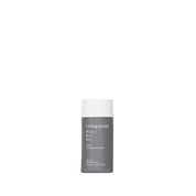 A bottle of Perfect hair Day™ 5-in-1 Styling Treatment with a gray body and white cap, designed to smooth and volumize, stands upright against a plain white background.