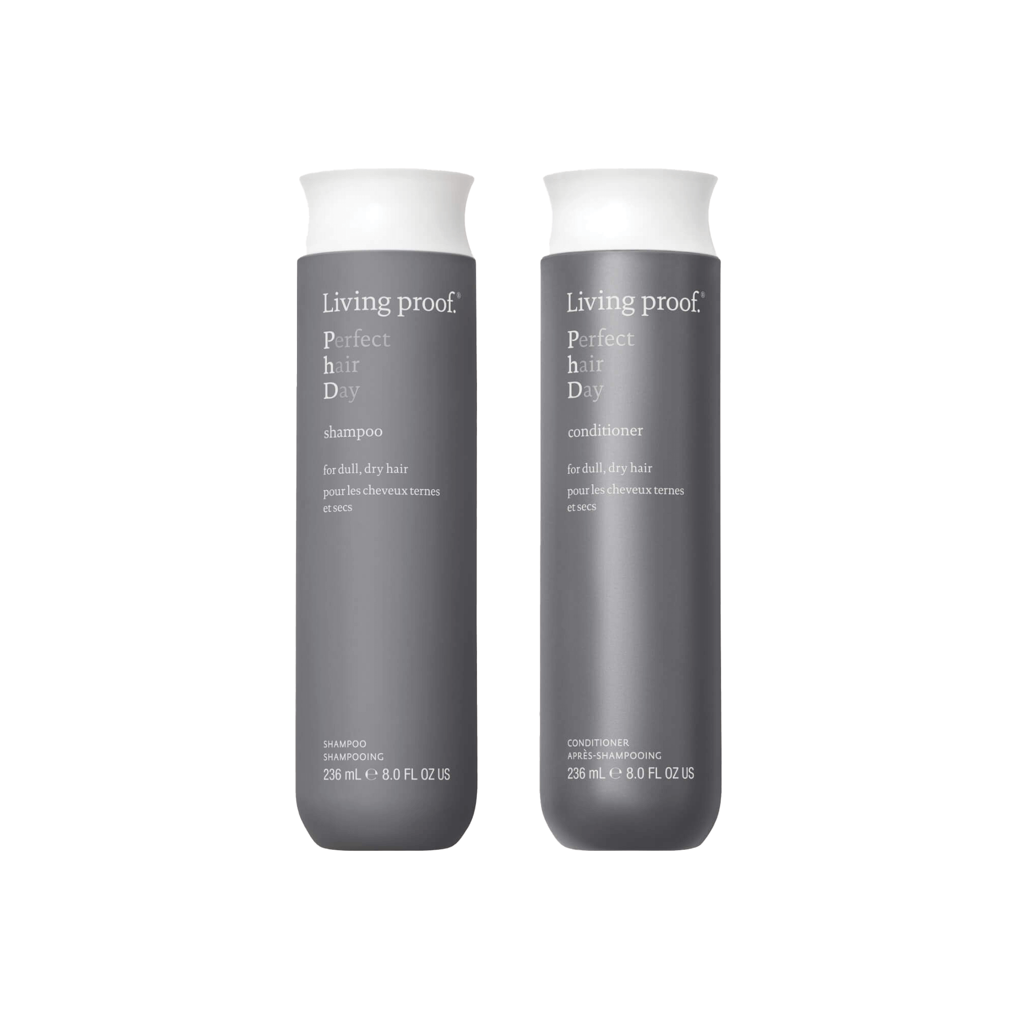 Two 236 ml bottles of Perfect hair Day™ Wash Duo—shampoo and conditioner—in sleek gray packaging with white caps, designed to hydrate and revitalize dull, dry hair.