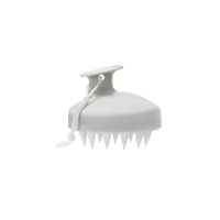 The Scalp Care Massager is a white handheld tool with a handle, pointed silicone bristles, and a looped hanging cord, designed to boost circulation and exfoliate the scalp. Shown isolated on a transparent background.