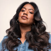 Model with dark curled hair