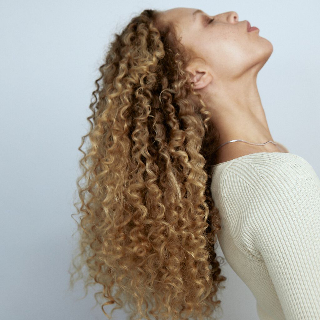 Is the Sun Good For Your Hair? Benefits, Risks & Tips