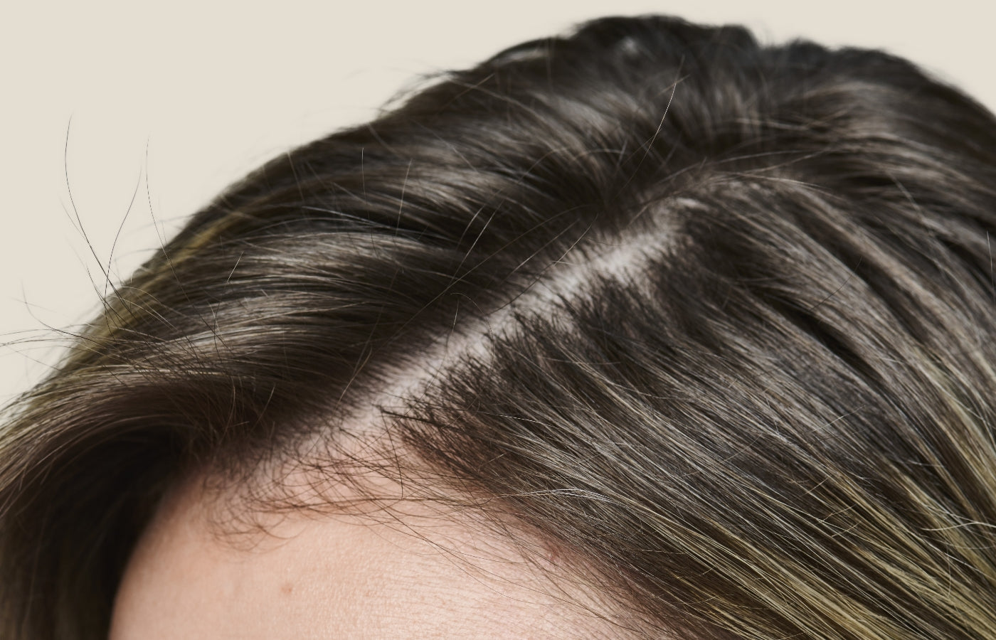 Woman's hair parted and baby hairs