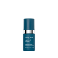 A blue bottle of Triple Bond Complex leave-in treatment with a pump dispenser and white text labeling contains 45 mL (1.5 fl oz) for visibly stronger hair.