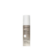 A 45ml bottle of No Frizz Smooth Styling Serum, with a white cap and gray-and-white label, is ideal for thick or coarse hair to smooth, fight frizz, and achieve a sleek blowout.
