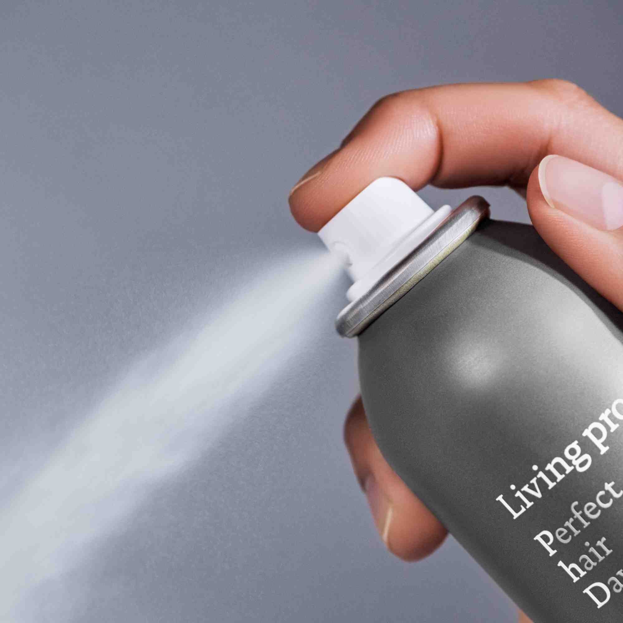 Action shot showing spraying mechanism of Perfect hair Day Dry Shampoo