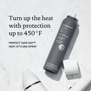 Living Proof Perfect Hair Day heat styling spray bottle on a light gray background with text about heat protection. Turn up the heat with protection up to 450 degrees F
