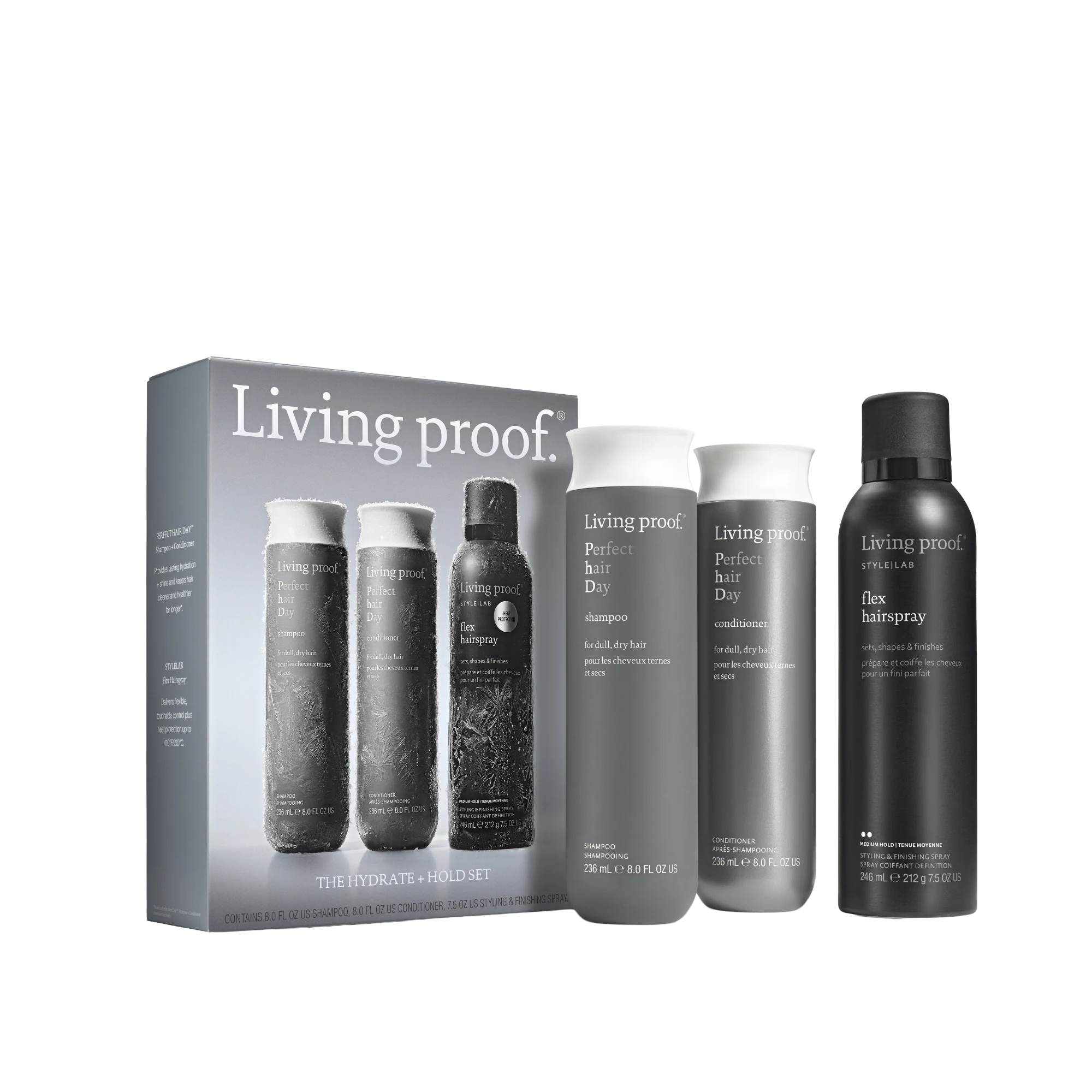 The Hydrate + Hold Set showcases three must-haves: Conditioner, Perfect hair Day Shampoo, and Flex Hairspray. Each bottle—one gray, one white, and one black with bold white lettering—stands upright before the sleek product box.
