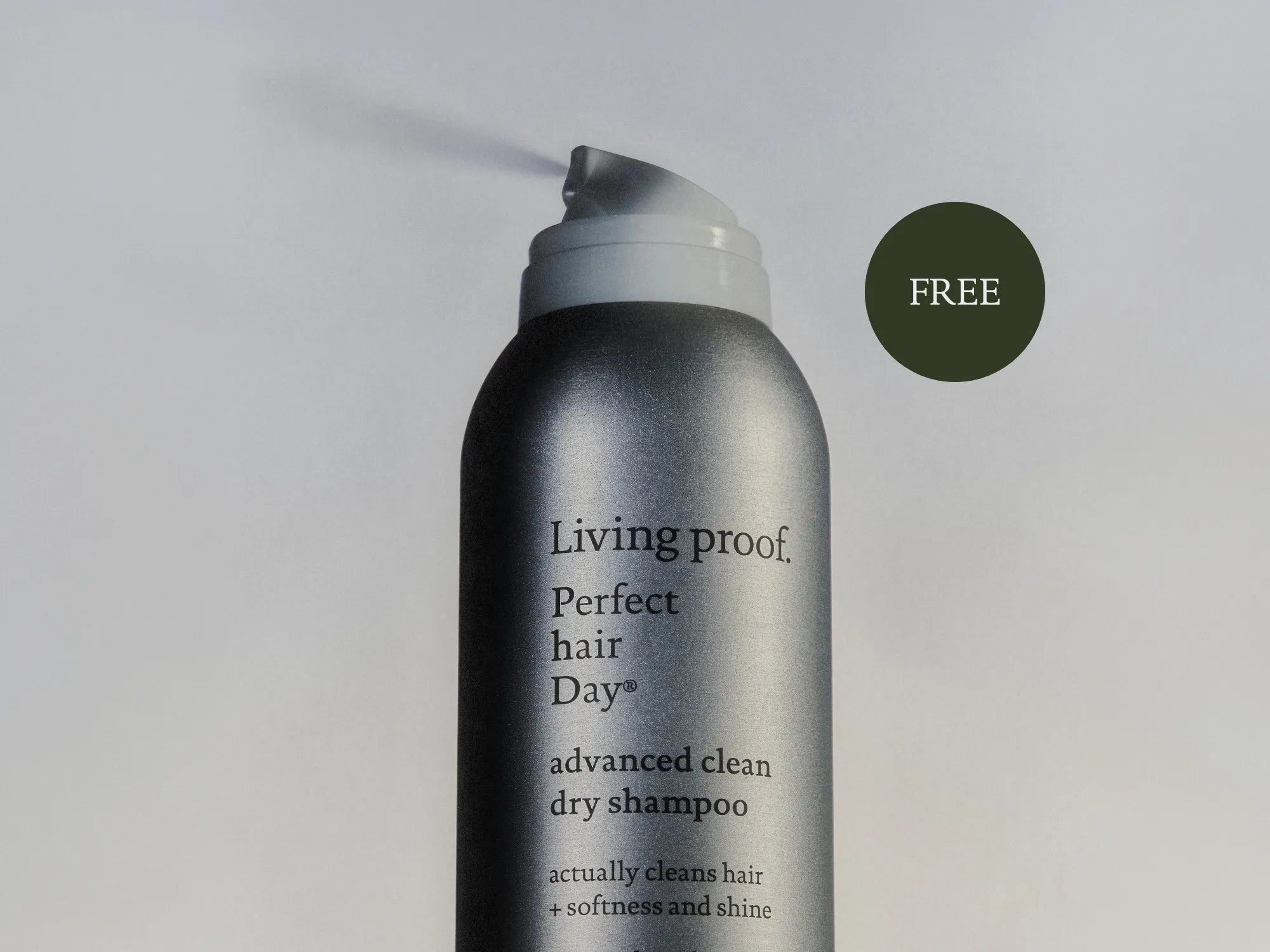 Living Proof dry shampoo bottle on a light gray background