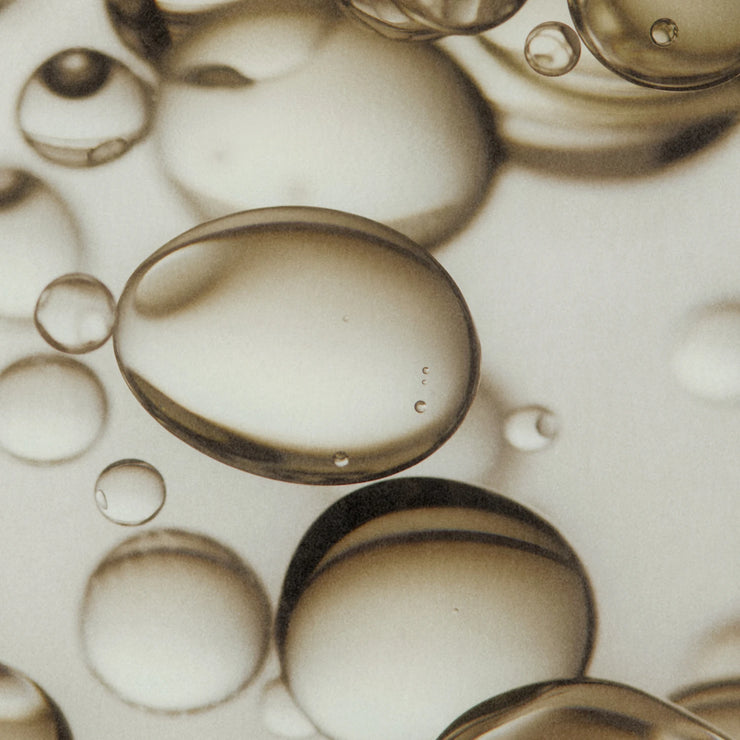 Close-up of water bubbles on a beige background
