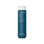 A teal bottle of Clarifying Detox Shampoo with a white cap and white text, designed to deeply cleanse and remove buildup—including from hard water. The bottle contains 236 ml (8 fl oz) of shampoo.