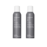Two gray aerosol cans of the Dry Shampoo Duo stand upright side by side on a white background, each featuring white text and a white cap. Designed to absorb oil, theyre perfect for refreshing hair.