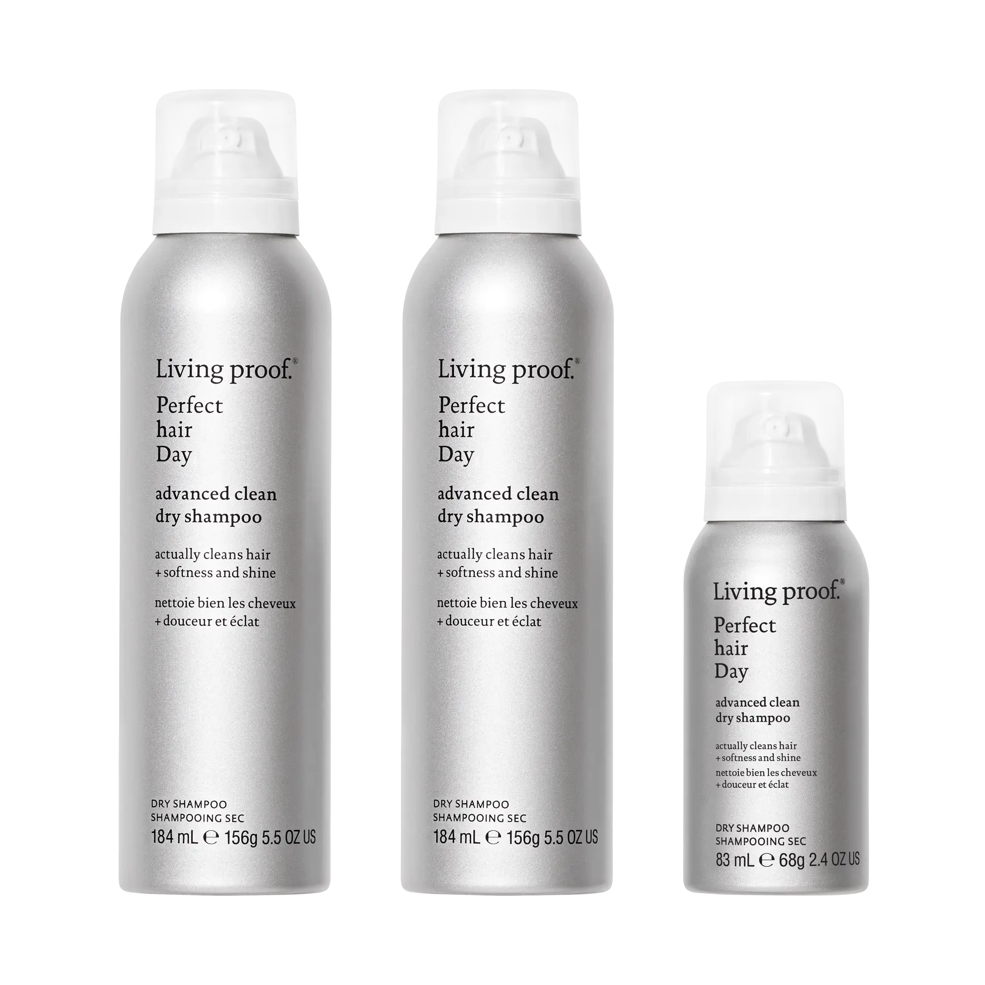 Three silver cans from The Advanced Clean Set, each in a different size with white caps and black text on the front, are arranged upright against a white background. These cans highlight a formula that extends time between washes while leaving your hair feeling as soft as if it were just washed.