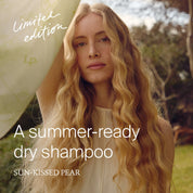 Woman with long blonde hair in a natural setting, promoting a summer-ready dry shampoo product.