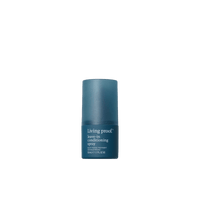 A blue bottle of Leave-In Conditioning Spray stands upright on a plain white background, delivering weightless conditioning—making it an essential for wash day.