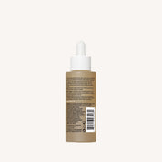 A brown bottle with a white dropper cap, shown from the back with product info and barcode, features No Frizz Vanishing Oil—a hydrating hair oil for shiny hair—set against a plain light background.