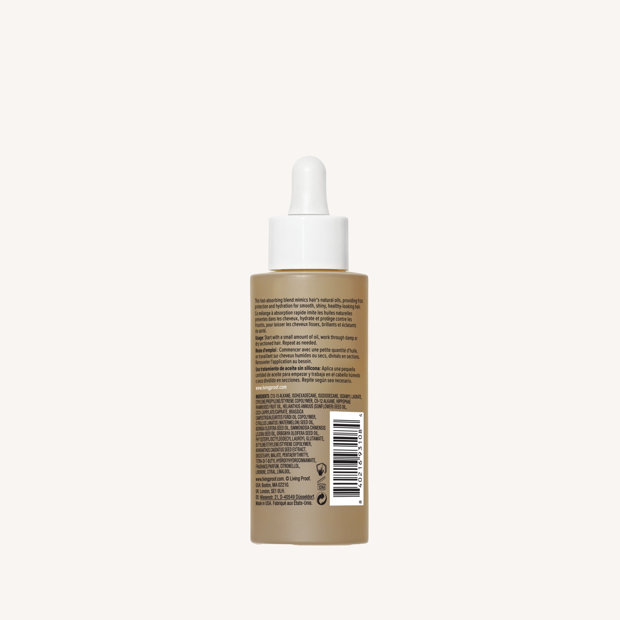 A brown bottle with a white dropper cap, shown from the back with product info and barcode, features No Frizz Vanishing Oil—a hydrating hair oil for shiny hair—set against a plain light background.