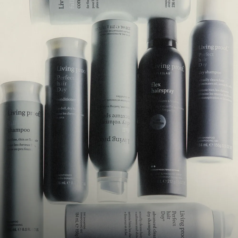 Collection of Living Proof hair care products on a light background