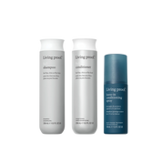 Three bottles of Living Proof hair care products on a white background