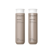 Two beige bottles of the No Frizz Wash Duo (Living Proof No Frizz Shampoo and Conditioner, 236 ml each) with minimalist labels and white caps stand side by side. For frizzy hair, powered by Sili-CLONE™ HairTech.