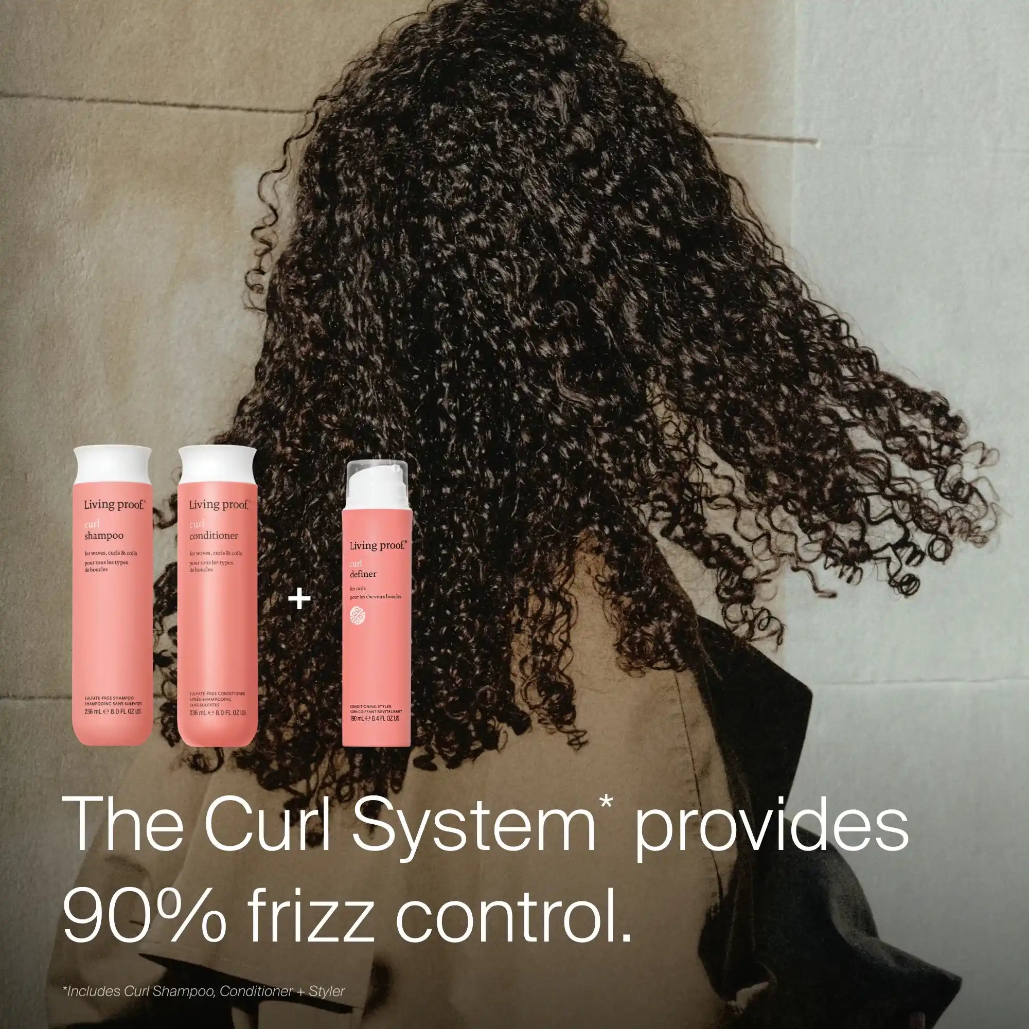 A person with curly hair stands facing away, showing defined curls. Three pink bottles of Curl Conditioner are displayed on the left. Text reads: “The Curl System provides 90% frizz control and helps detangle curls.”.