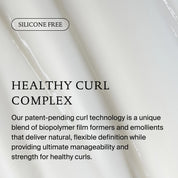 Text on a white marble background highlights Curl Conditioner’s Healthy Curl Complex, which is silicone-free and uses biopolymer film formers and emollients to detangle, strengthen, and define curls for healthy, beautiful hair.