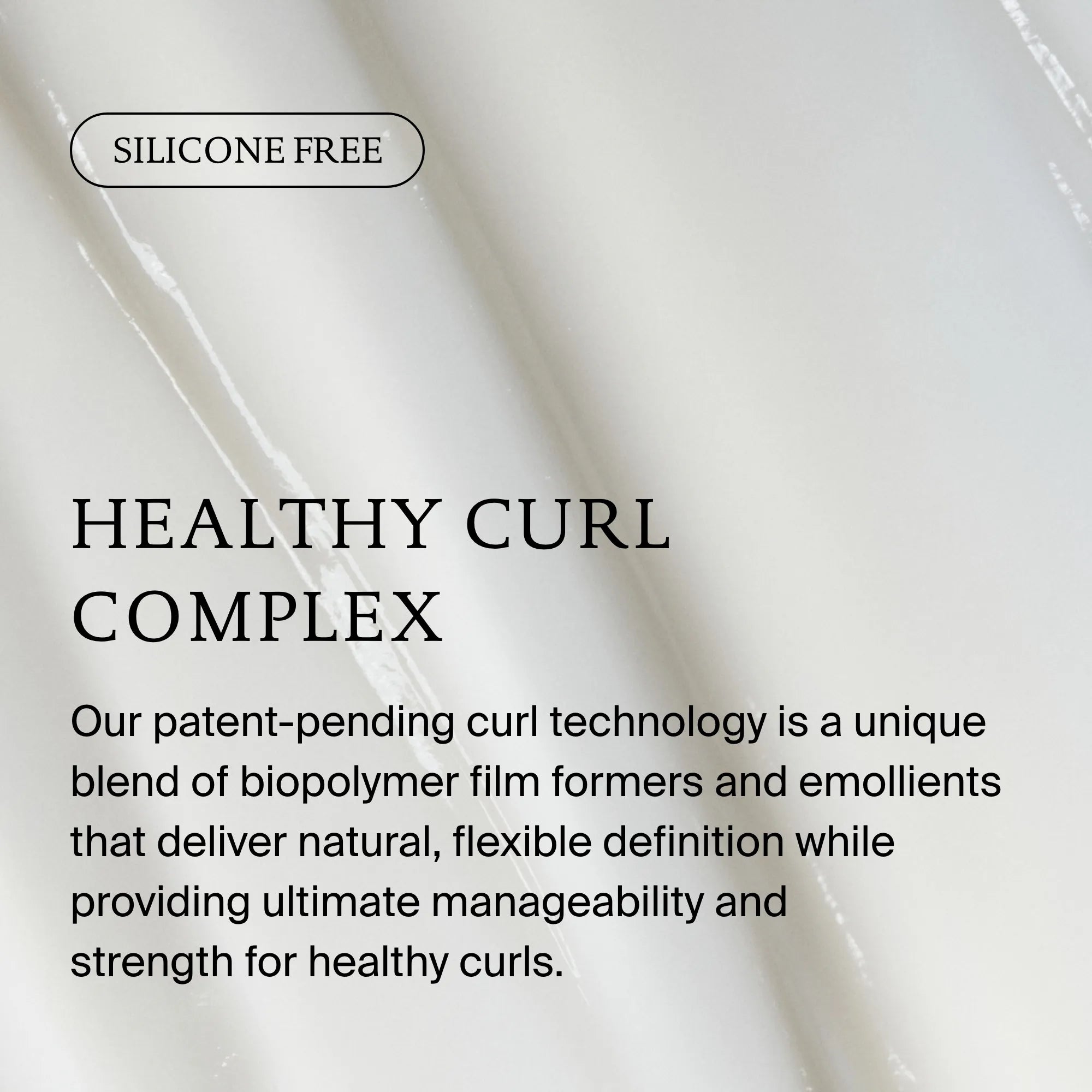 Text on a white marble background highlights Curl Conditioner’s Healthy Curl Complex, which is silicone-free and uses biopolymer film formers and emollients to detangle, strengthen, and define curls for healthy, beautiful hair.