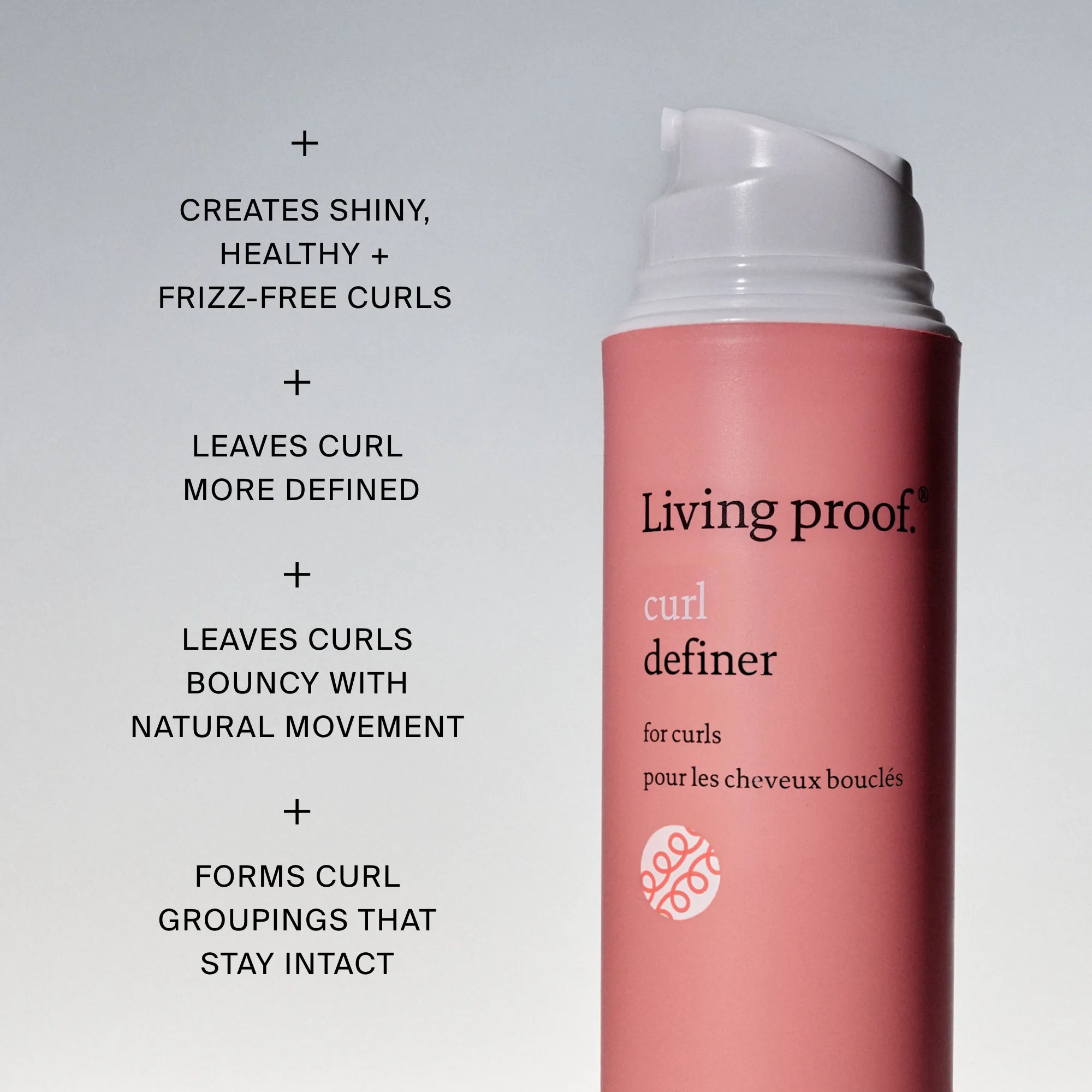 A pink bottle of Curl Definer is shown. Text lists benefits: creates shiny, frizz-free curls; defines curls; adds bounce and natural movement; and keeps curl groupings intact.