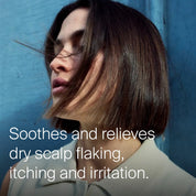 Woman with short hair against a blue wall, text about scalp care.