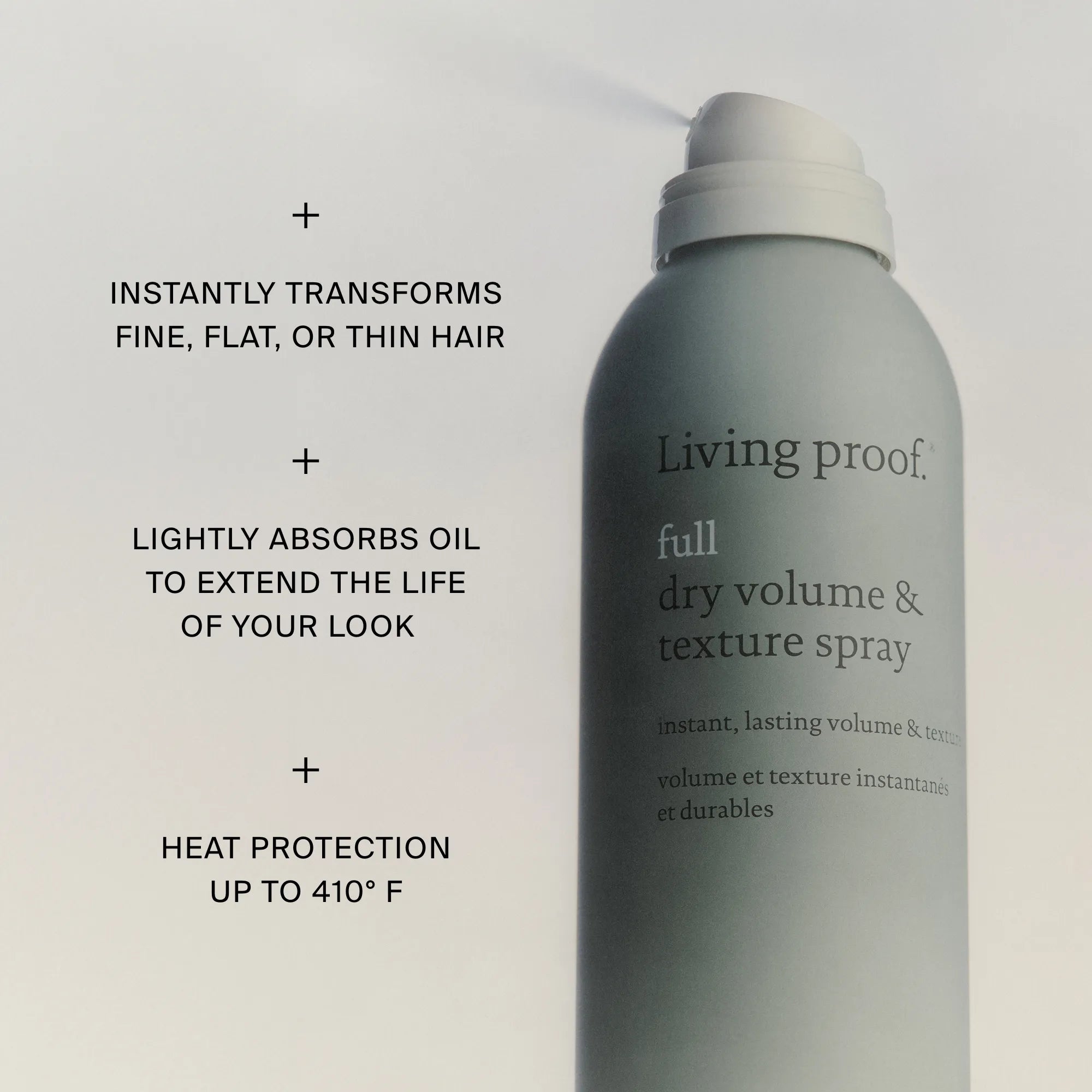 Living Proof dry volume and texture spray bottle with text highlighting features on a light gray background