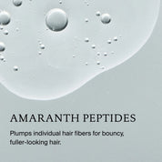 Close-up of clear liquid droplets on a light gray background, with text: Full Volume & Root-Lifting Spray. This invisible spray plumps individual hair fibers for bouncy, fuller-looking hair and provides heat protection.