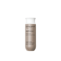 Living Proof No Frizz conditioner bottle on a black background