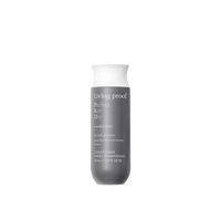 Living Proof Perfect Hair Day conditioner bottle on a black background