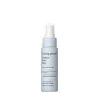A light blue bottle of Perfect hair Day™ Style Refresh Mist with a white spray cap is shown upright on a white background. This mist reshapes hair, refreshes your style, and provides thermal protection.