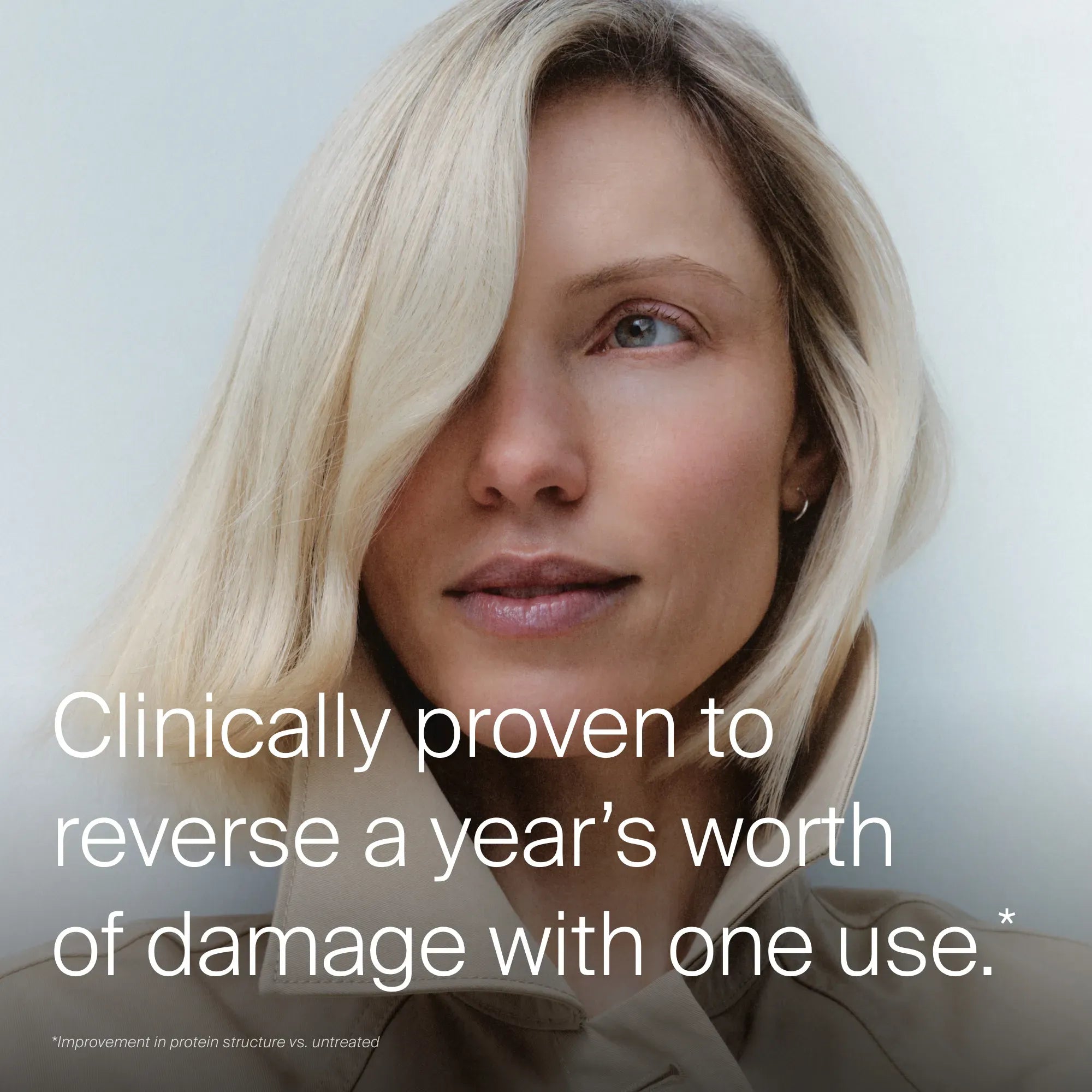 A woman with straight, blonde hair and clear skin looks at the camera, smiling. Text reads: Triple Bond Complex—clinically proven mask reverses a year of damage in one use. Small print appears at the bottom.