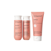 Three pink bottles of the Curl Definition + Moisture Set stand upright against a white background, promising frizz-free curls. Each bottle is labeled in English and French.
