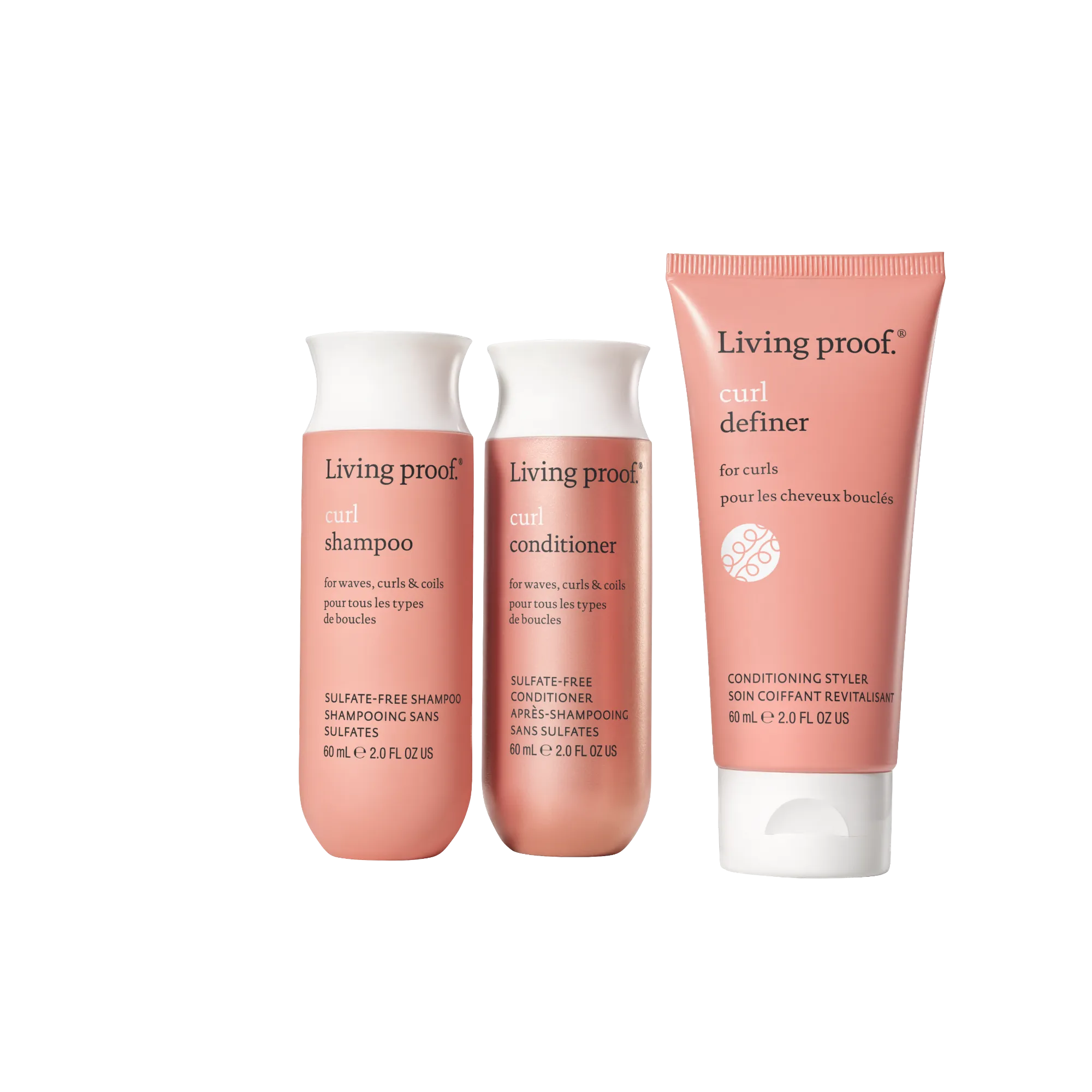 Three pink bottles of the Curl Definition + Moisture Set stand upright against a white background, promising frizz-free curls. Each bottle is labeled in English and French.