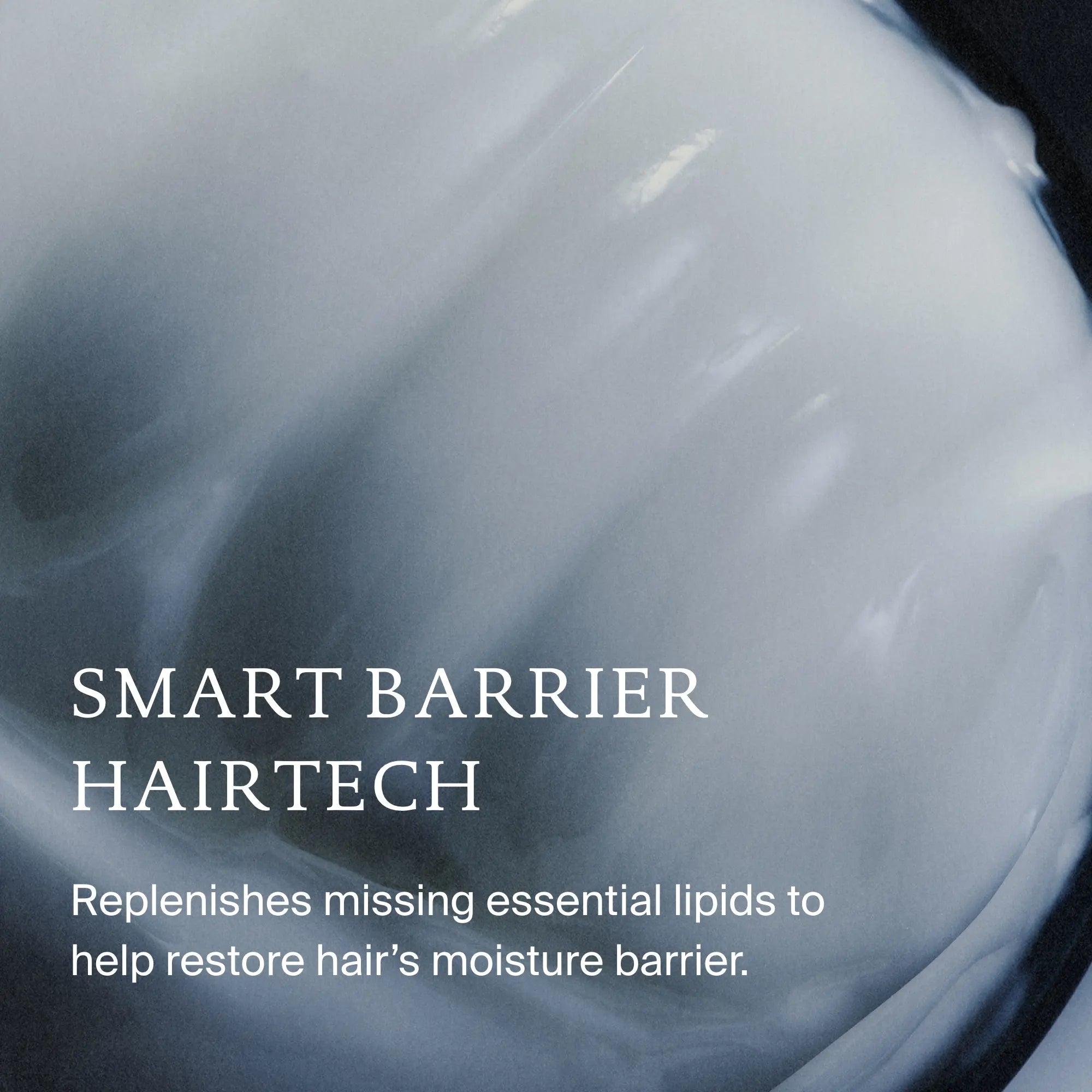 Close-up of a creamy, white in-shower Moisture Rescue Mask with text overlay: SMART BARRIER HAIRTECH. Replenishes essential lipids to restore hair moisture for silky-soft results.