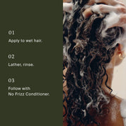 A person with wet, curly hair lathers No Frizz Shampoo, shown from behind. Text lists frizz control steps: 1. Apply to wet hair. 2. Lather, rinse. 3. Follow with No Frizz Conditioner for smooth, manageable hair.