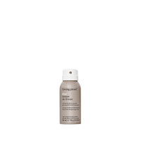 A small spray can of No Frizz Instant De-Frizzer dry conditioning spray, with a grey and white label, delivers softness and tames frizz, shown against a plain white background.
